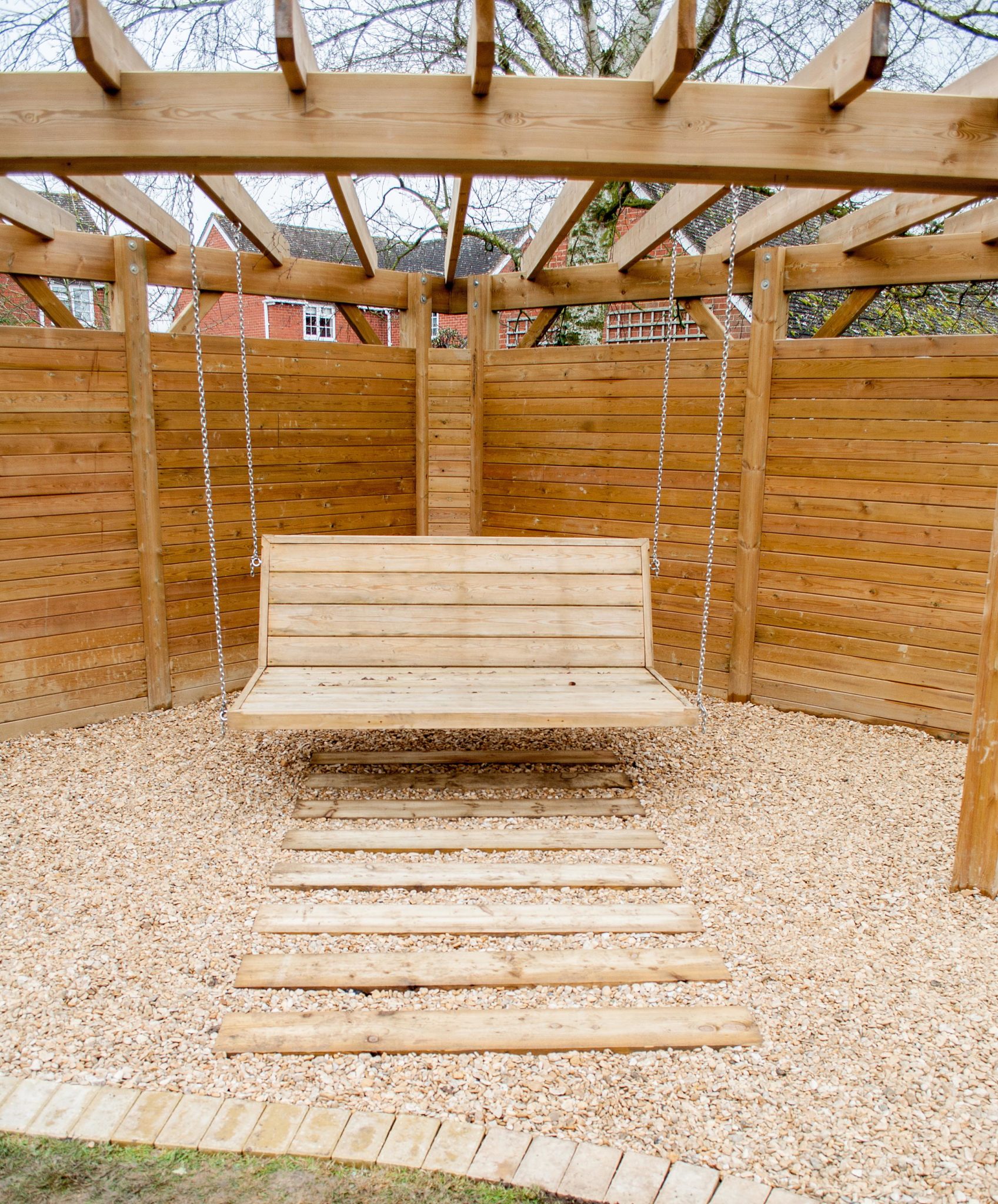 Sleeper Steps leading to pergola swing