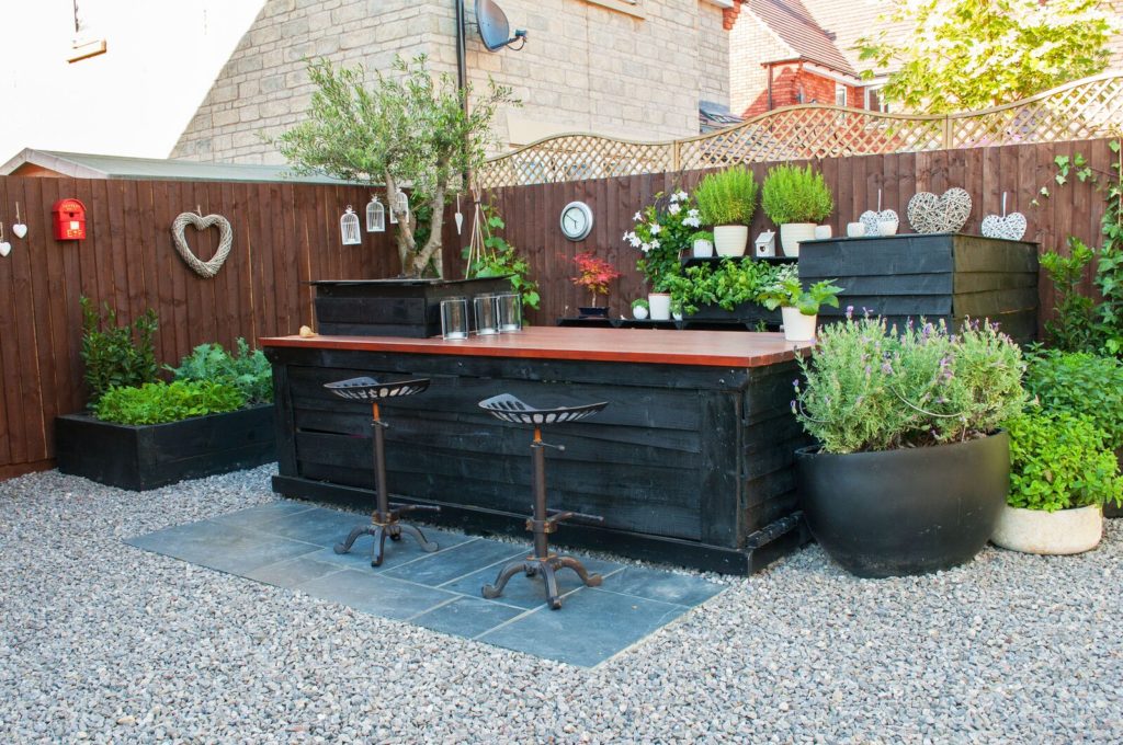 innovative small garden with outside bar