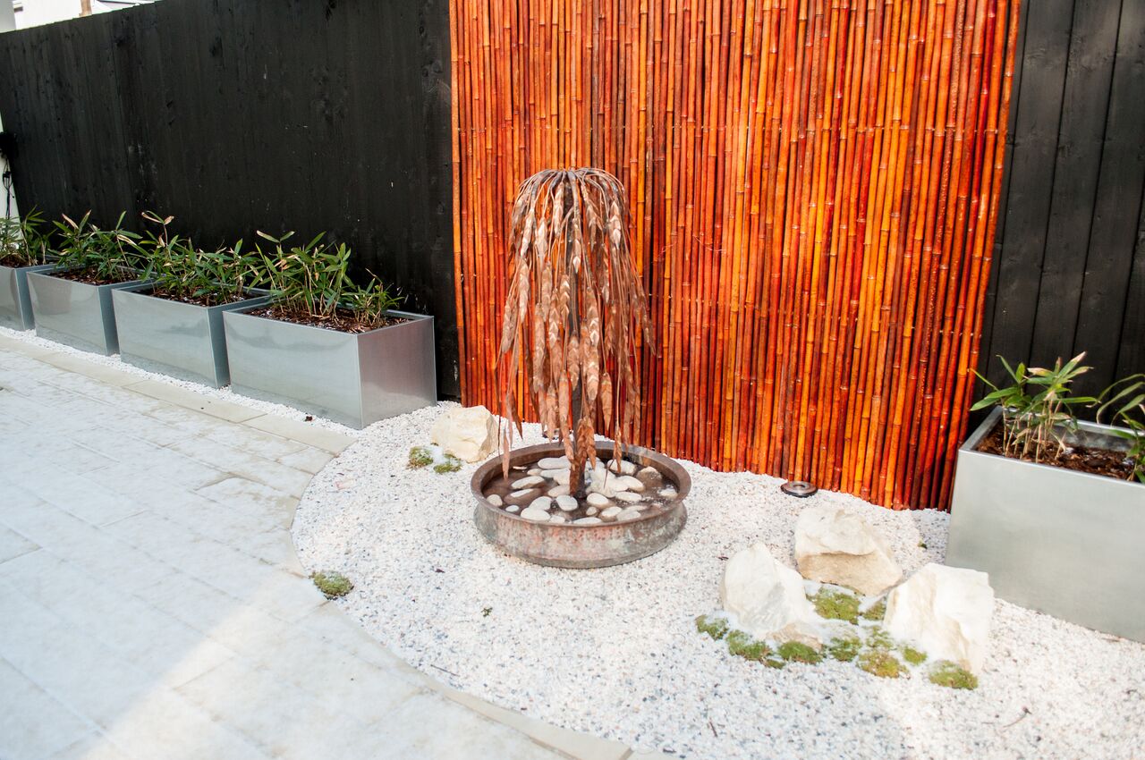 george stone garden with metal water feature